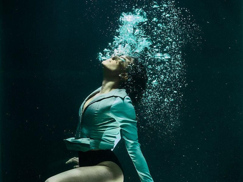 Person in mid-motion, showing fluid and graceful movement.